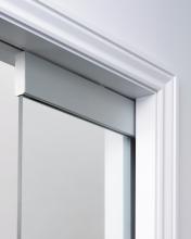 Frameless glass door kit requiring architrave